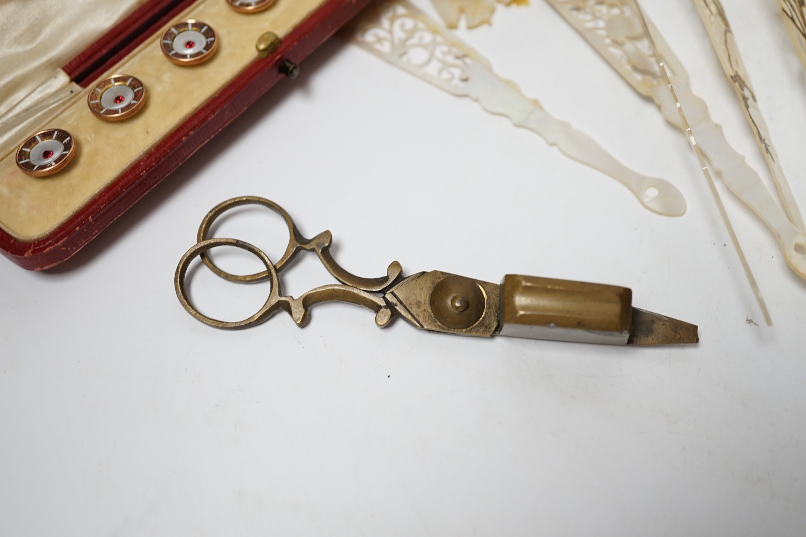 Cased enamel and paste dress studs, a French mother of pearl fan and Lorgnettes